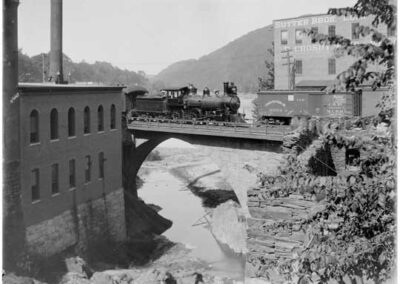 Steam locomotive crossing Railroad Bridge over the Whetstone Brook in Brattleboro