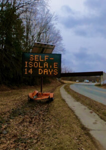 self isolation road sign 